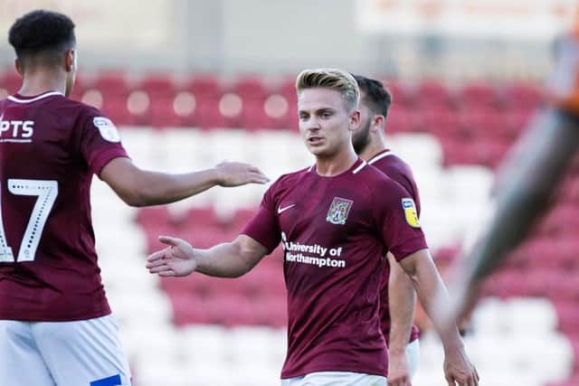 SHARP START: Sam Hoskins takes the credit after doubling Town's lead during the first-half of Tuesday's friendly against Barnet at the PTS Academy Stadium. Pictures: Kirsty Edmonds
