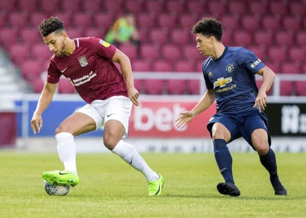Daniel Powell in action during the Cobblers' 2-0 win over a Manchester United XI on Friday night (Picture: Kirsty Edmonds)