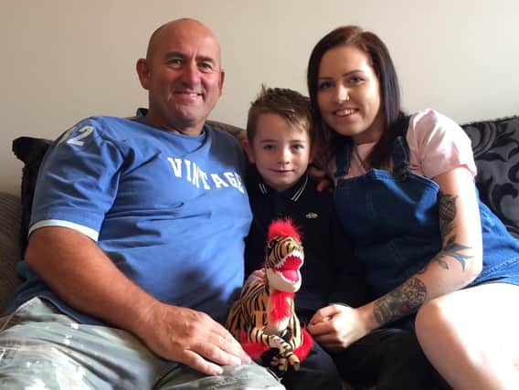 Five-year-old Riley sprang into action when his mum Megan fell to the floor. Grandad Kevin (right) says he is a "little superhero".