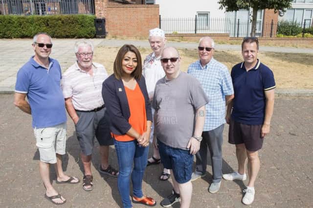 Pictured front left-right: Northamptonshire County Councillor for Sixfields Division Pinder Chauhan with chair of Upton Meadows Residents' Association Nick Alex.