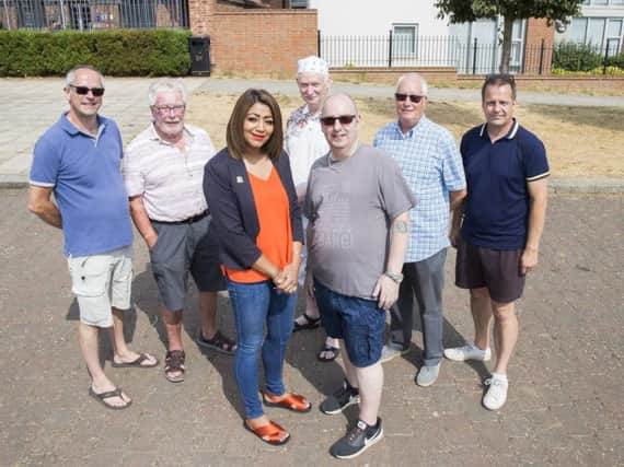 Pictured front left-right: Northamptonshire County Councillor for Sixfields Division Pinder Chauhan with chair of Upton Meadows Residents' Association Nick Alex.