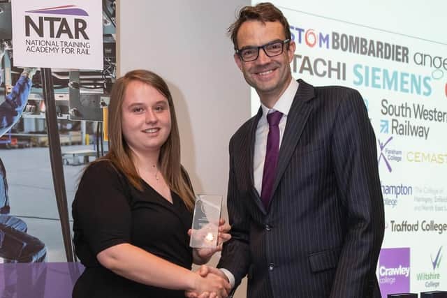 Charlotte Mortimer receiving her award from Simon Elton.