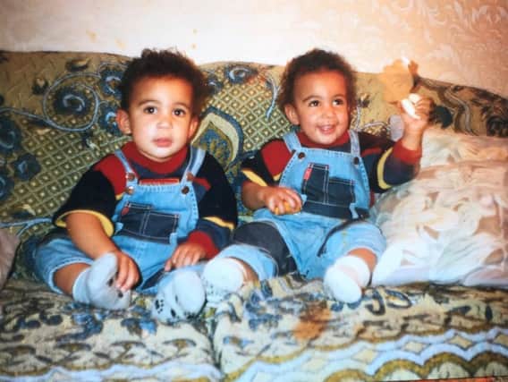 Eugene and Bijan Shahrezaey pictured as babies back at their family home in Guildford.