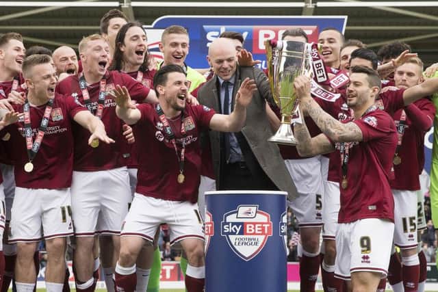 Marc Richards lifts the league two trophy in 2016. David Buchanan believes the current Cobblers squad is as good as Chris Wilder's was