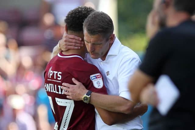 Dean Austin consoles a devastated Shaun McWilliams after injury curtailed his afternoon. Picture: Sharon Lucey