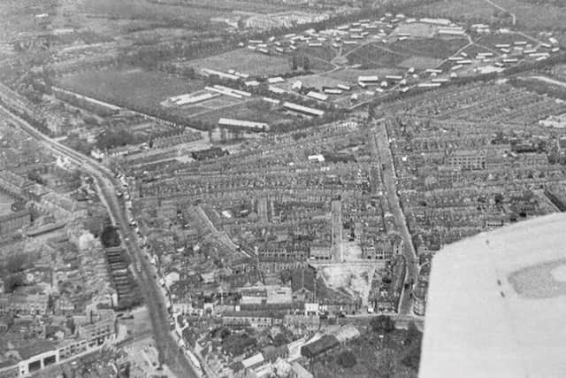 A late 1940s view of Northampton town centre, showing the Racecourse with a POW camp with its white huts