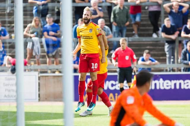 OFF THE MARK! Kevin van Veen celebrates his first Cobblers goal after heading home an equaliser in the opening 45 minutes against Carlisle. Pictures: Kirsty Edmonds