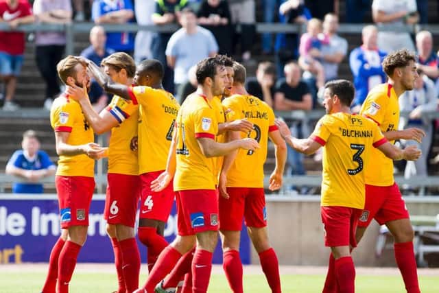 Cobblers celebrate van Veen's goal