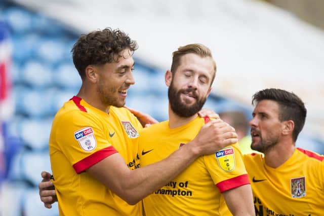 ON TARGET: Kevin van Veen headed Cobblers level and then Matt Crooks steered them in front, only for Carlisle to hit straight back. Pictures: Kirsty Edmonds