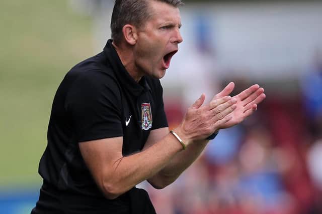 Dean Austin roars his side on during Saturday's clash with Cambridge United. Picture: Sharon Lucey