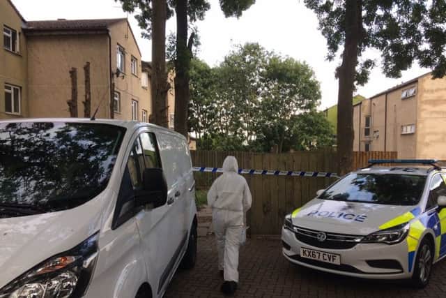 A forensic officer working on the scene of Thomas Gravestock's murder in Corby NNL-180823-190955005