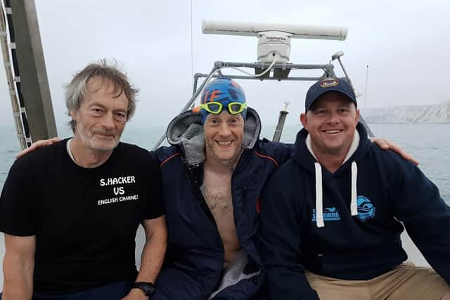 Left to right: Dad Keith Hacker, Stu Hacker and support swimmer Wes.