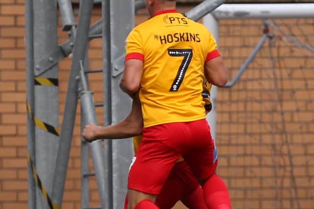 Sam Hoskins celebrates with Matt Crooks