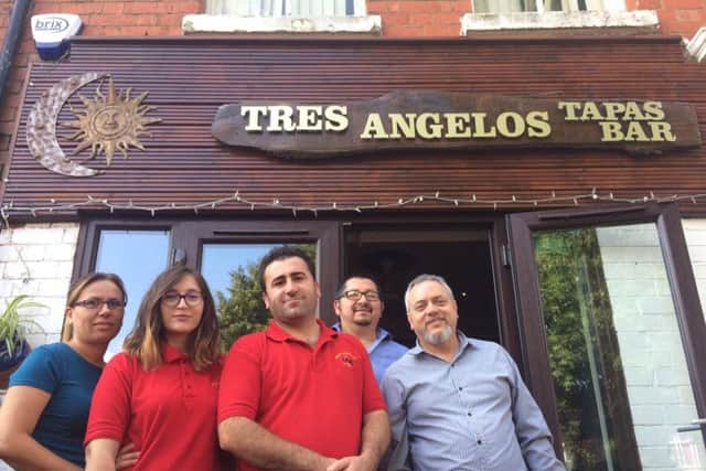 Aleksander, centre, and his new team at Tres Angelos in Kingsley Park Terrace.