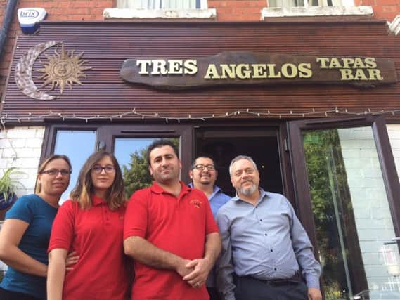 Aleksander, centre, and his new team at Tres Angelos in Kingsley Park Terrace.