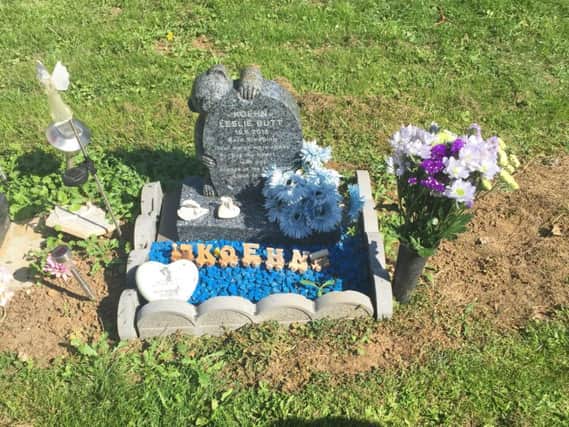 Blue stones from Koehn's grave were found scattered around Dallington Cemetery.