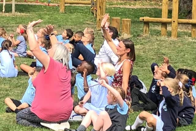 Pupils were filled with joy this afternoon while spending some of their first day back outdoors, waving at the Tiger Moth pilot.