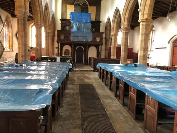 Tarpaulin has been draped over parts of All Saints Church to mitigate water damage