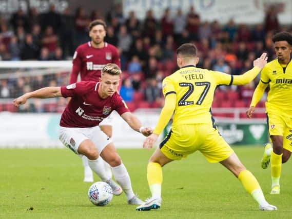Sam Hoskins takes on his man during the Cobblers' 3-1 defeat to Cheltenham Town (Kirsty Edmonds)