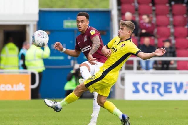 Shay Facey passes a ball down the line