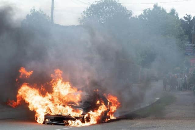 The car was well alight by the time firefighters arrived at the scene, in Great Brington