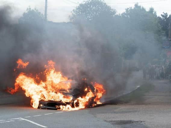 The car was well alight by the time firefighters arrived at the scene, in Great Brington