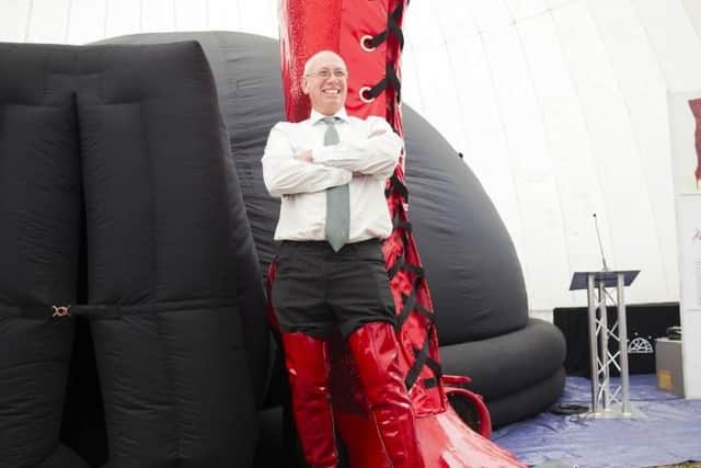Former boss of WJ Brookes shoe factory Steve Pateman modelling 'kinky boots' in the same way he did for his company's catalogue