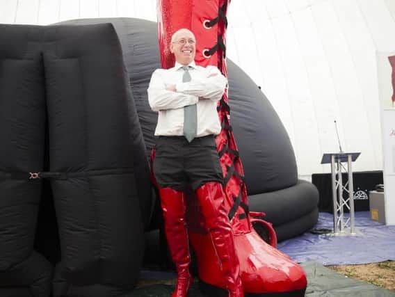 Former boss of WJ Brookes shoe factory Steve Pateman modelling 'kinky boots' in the same way he did for his company's catalogue