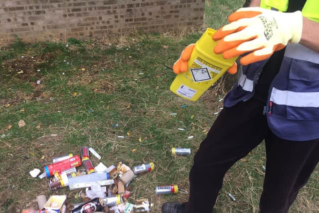 Sarah finds and disposes of a syringe found on a pile of rubbish.