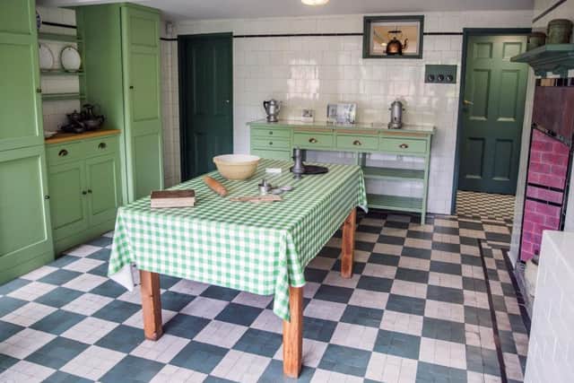 The kitchen still features its former kitchen and wall tiles from 1916.