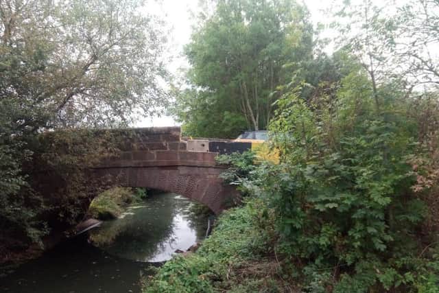 The damaged bridge carries Banbury Lane over Wootton Brook