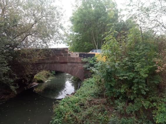 The damaged bridge carries Banbury Lane over Wootton Brook