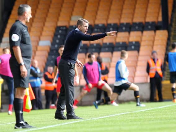 Dean Austin barks instructions from the sidelines during the 2-0 defeat to Port Vale. Picture by Sharon Lucey.