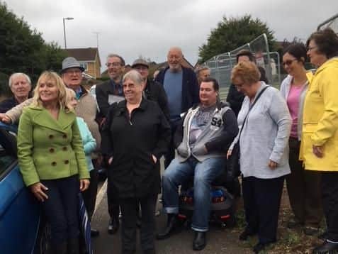 Protesters gathered on Lancaster Way, in Delapre, this morning to voice their concerns over badgers welfare on a site sold to Barry Howard for 140 new homes.