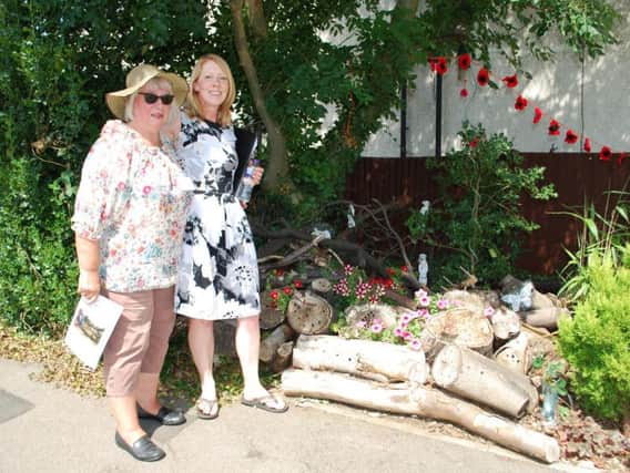 Dee Whitehead and Jacqueline Abbott from the Far Cotton Land Girls, next to their display in Lancaster Way.