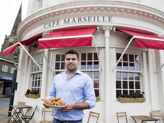 Restaurant manager Dennis Potapenko pictured outside Cafe Marseille on Sheep Street.