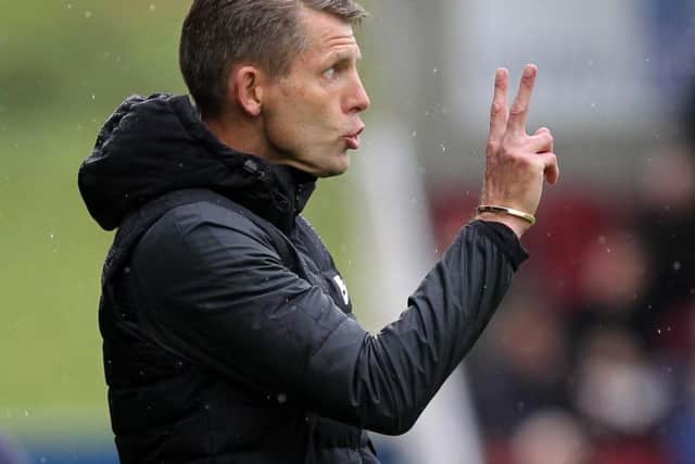 Dean Austin had a busy afternoon on the touchline, engaging in numerous confrontations with the fourth official. Picture: Sharon Lucey