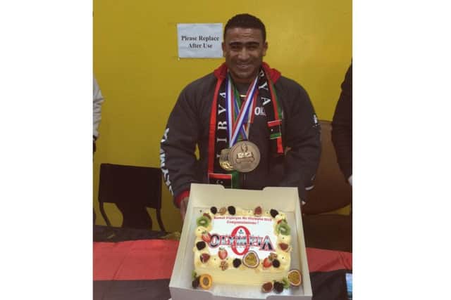 After months of clean eating and training, Kamal can finally enjoy a slice of cake. Cake designed by JJCakes Northampton.