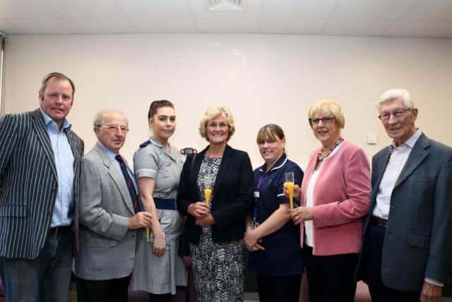Members of the Kislingbury Jazz Festival Team including, Steve Smith, Dennis Tidmarsh, Di Ward, Patricia Kidson and Alan Cook, have raised over 8,000. Pictured centre: junior sister Chelsea Jackson and ward matron Emma Cuthbert.