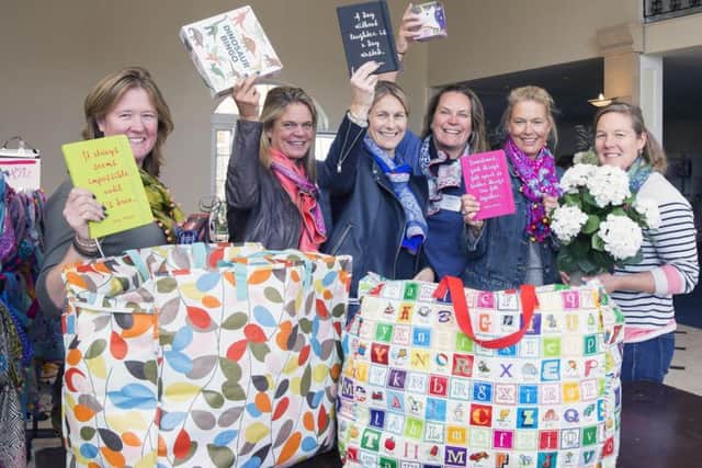 Organisers of Whittlebury Charity Shopping Fair pictured in preparation for their shopping fare, in aid of Macmillan and other good causes. L-R: Committee members Amanda Smith, Sam Satchell, Laura Wade, Carolyn James, Min Pumphrey and Emma Danby.
