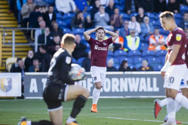 HEAD IN HANDS: This was one of Town's very few chances on Saturday as Sam Foley fails to convert a cross from Sam Hoskins. Pictures: Kirsty Edmonds