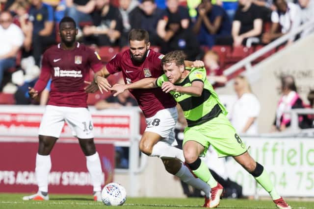 Jordan Turnbull keeps a close eye on Forest Green's Dayle Grubb (Pictures: Kirsty Edmonds)