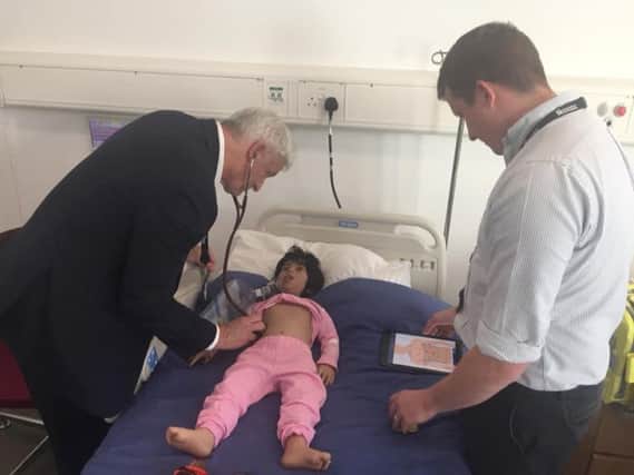 Vice chancellor Nick Petford tries out the new nursing training facility at the University of Northampton Waterside campus.