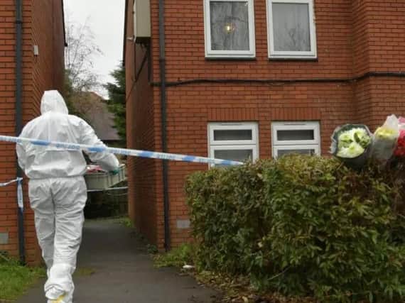 Forensic teams at the flat in Arthur Street.
