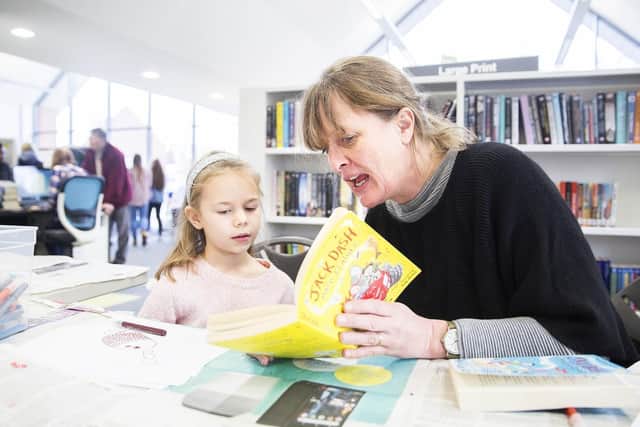 L-R: Nancy Smith and author Sophie Plowden reading Sophie's book, 'Jack Dash' at  Moulton Library's showcase earlier on this year.