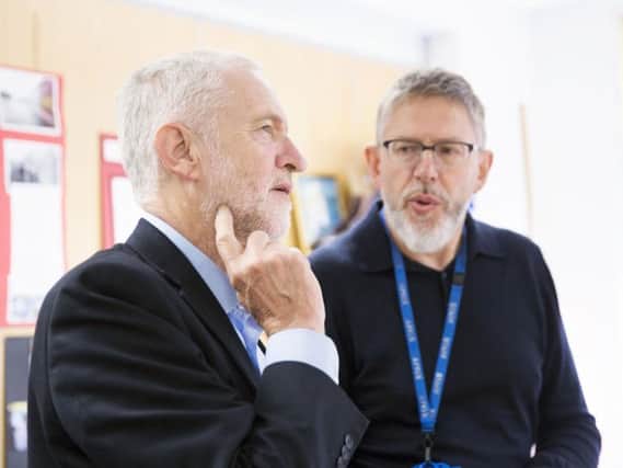 Robin Burgess showing Labour leader Jeremy Corbyn around the Hope Centre in September last year. The chief executive has spoken out about the charity's eviction from Oasis House today.