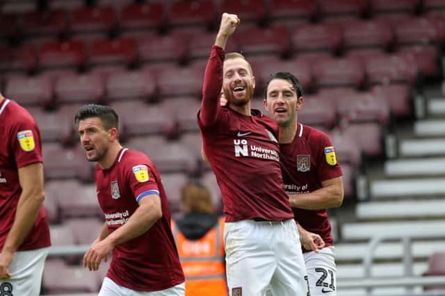 TWO IN FRONT! Kevin van Veen celebrates after scoring from the spot, putting Cobblers 2-0 ahead against Oldham. Pictures: Sharon Lucey