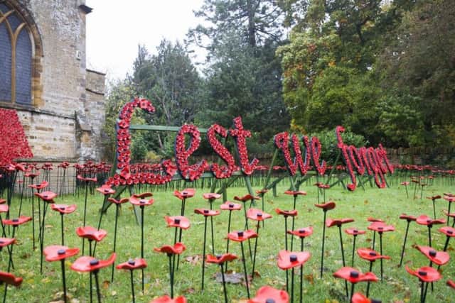 The ceramic poppy display at St Peter and St Paul's Church in Abington