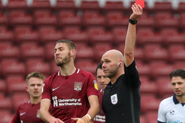 No Sam Foley for the Cobblers this weekend but thankfully no Charles Breakspear either. While he's been promoted to League One, Scott Oldham takes charge of his first Northampton game. He's yet to hand out a red card in six games this season.