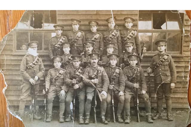 Private Birch (far left) poses for a photo with members of his regiment